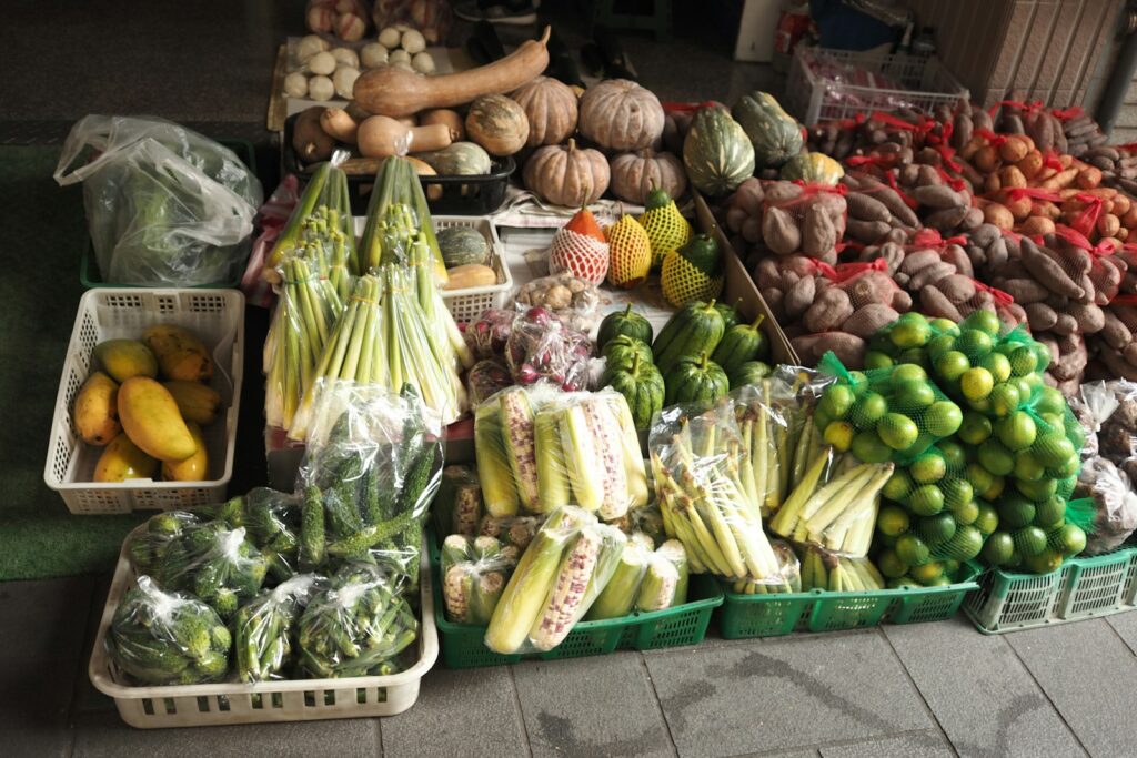 a bunch of fruits and vegetables are on display